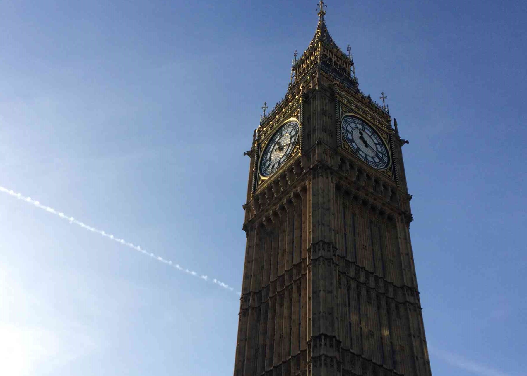 Close-up view of Big Ben clock tower against a clear blue sky.
